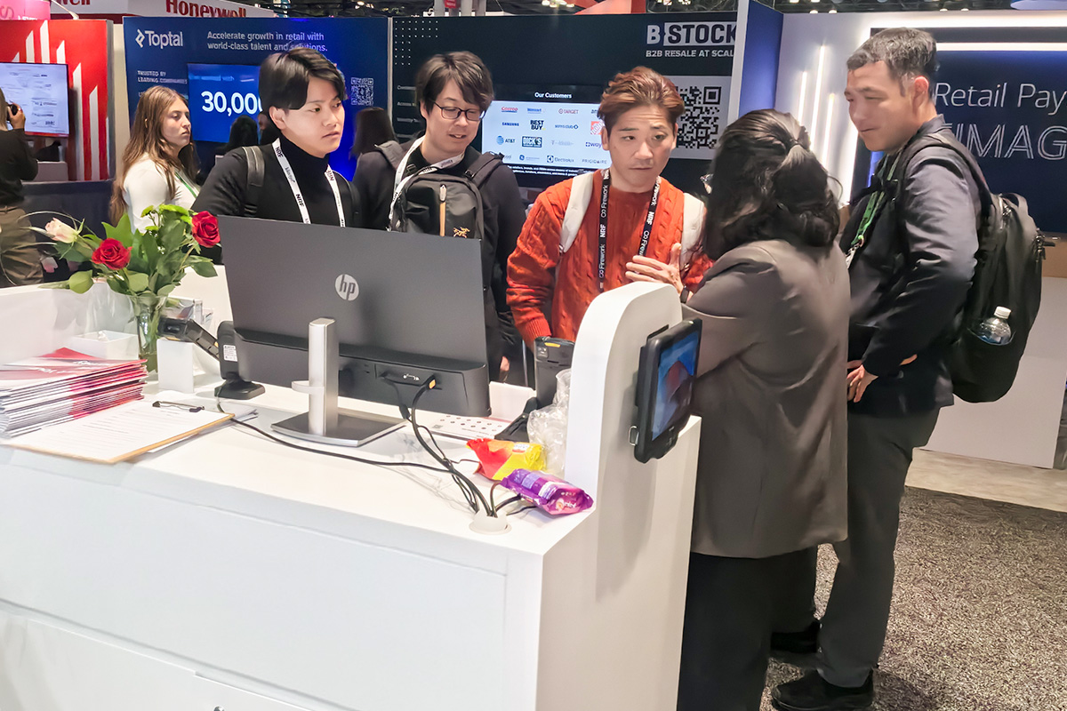 MEFERI representatives discussing retail solutions with visitors at NRF 2026