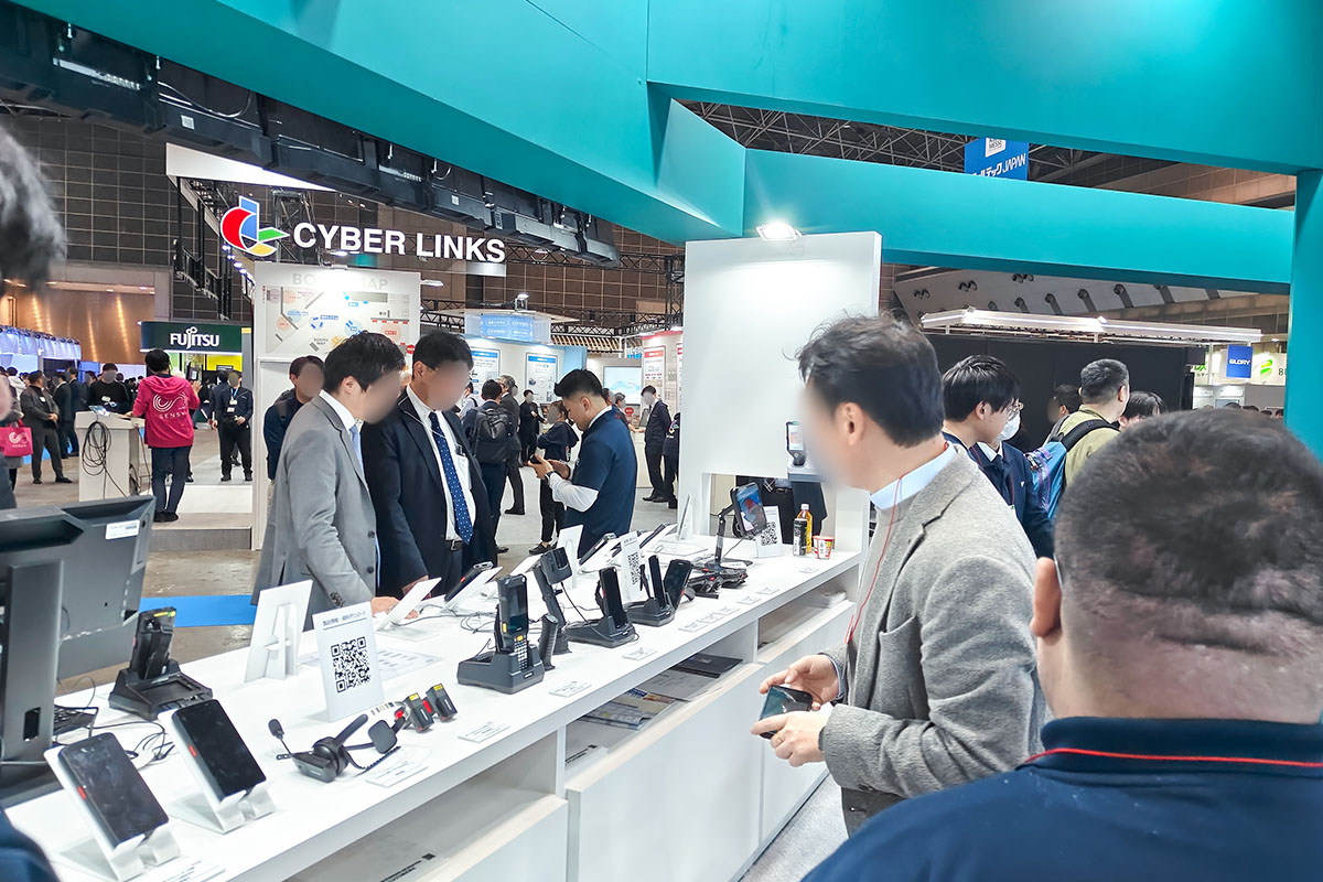 Visitors exploring MEFERI enterprise AIDC devices at RetailTech Japan 2026